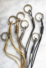 bag charm/
En nyckelring som är både stilren och praktisk. Perfekt för att hålla koll på dina nycklar eller som en snygg detalj på din väska. Finns i mjuka pasteller, mönstrad reflex eller färgstark neon, och kan bäras runt halsen under träningspass. Den chunky och glänsande designen med en rund karbinhake gör den lätt att använda och ger ett unikt utseende. Handgjord i Sverige med rostfritt stål och slitstarkt nylonsnöre