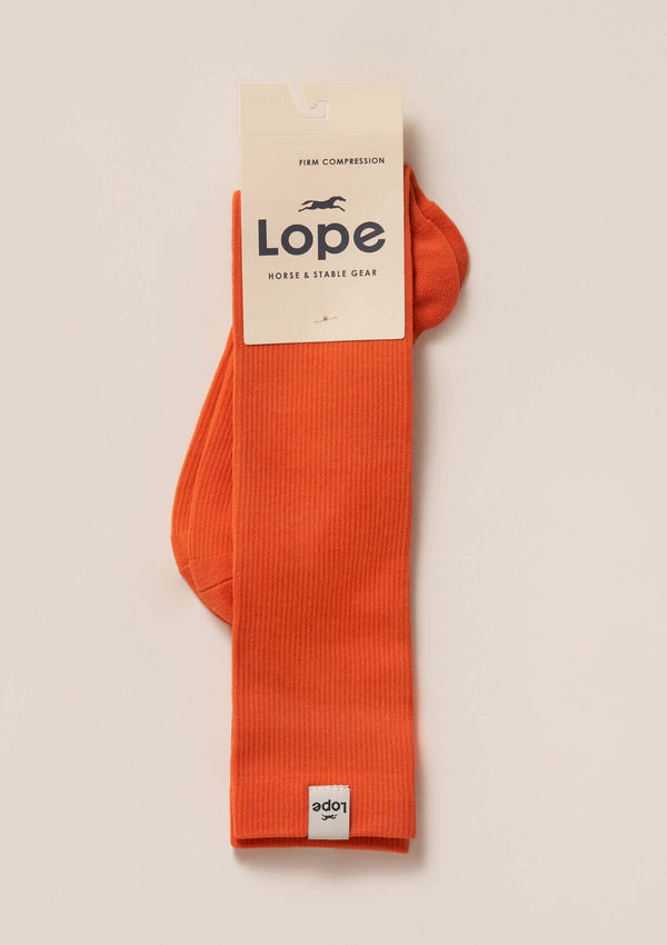 firm compression riding socks, stretchy and durable blend of polyamide and elastane. orange. firm compression riding socks, stretchy and durable blend of polyamide and elastane. orange. long compression comfortable sporty stylish riding socks. with lope logo firm compression riding socks, stretchy and durable blend of polyamide and elastane. orange. long compression comfortable sporty stylish riding socks. with lope logo. orange kompressions ridstrumpa one size snygg hållbar bekväm